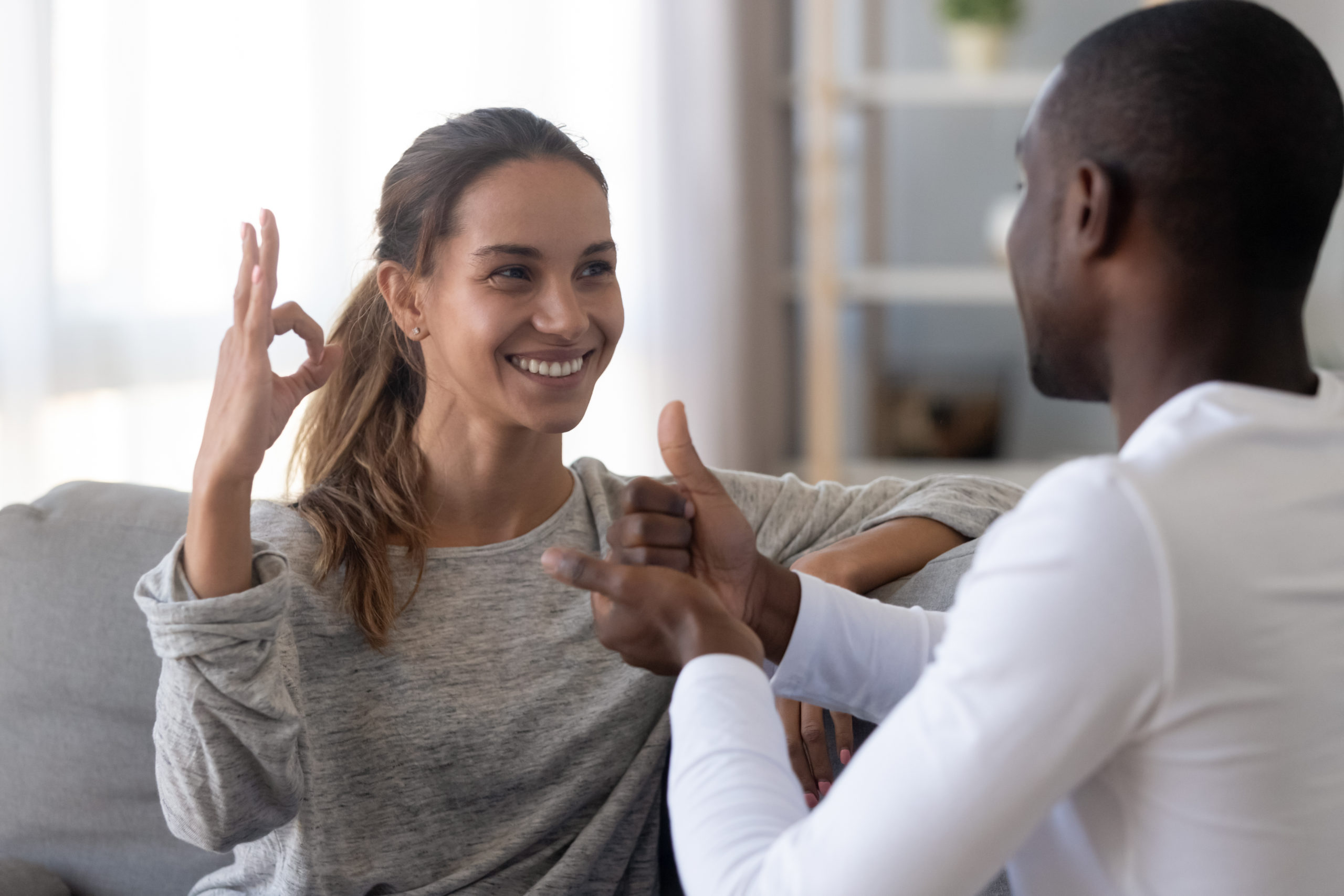 two people communicating using sign language